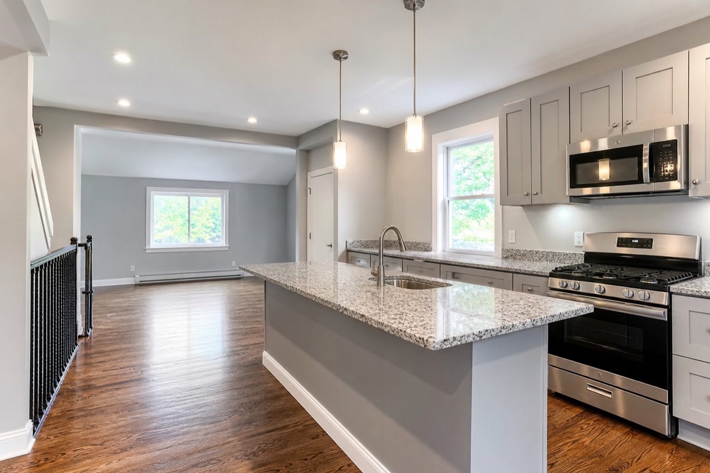 Modern renovated kitchen with granite countertops and stainless steel appliances